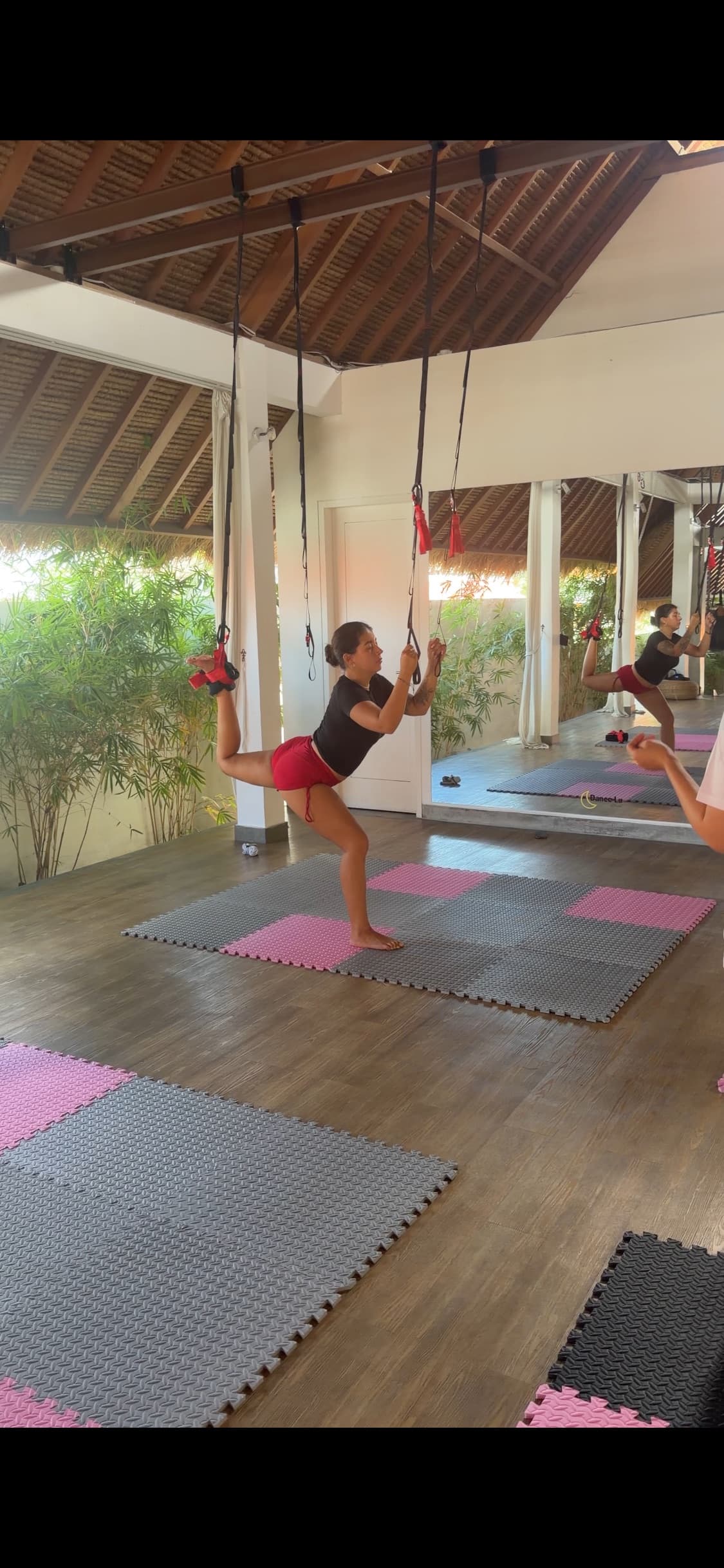 Gravity Stretching - hanging in suspension straps in a Bali studio